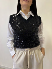 Gilet in paillettes con camicia abbinata